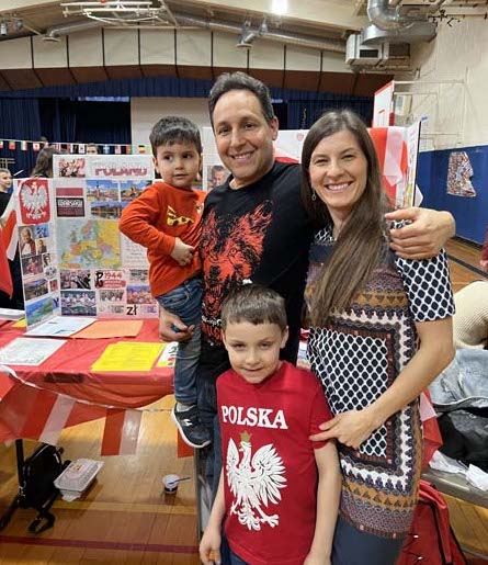 Parents and children posing for picture