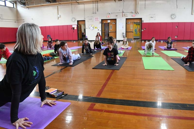 students practicing yoga