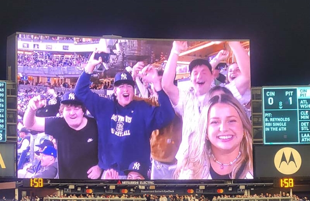 Students on baseball screen
