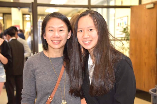 student and parent posing for picture