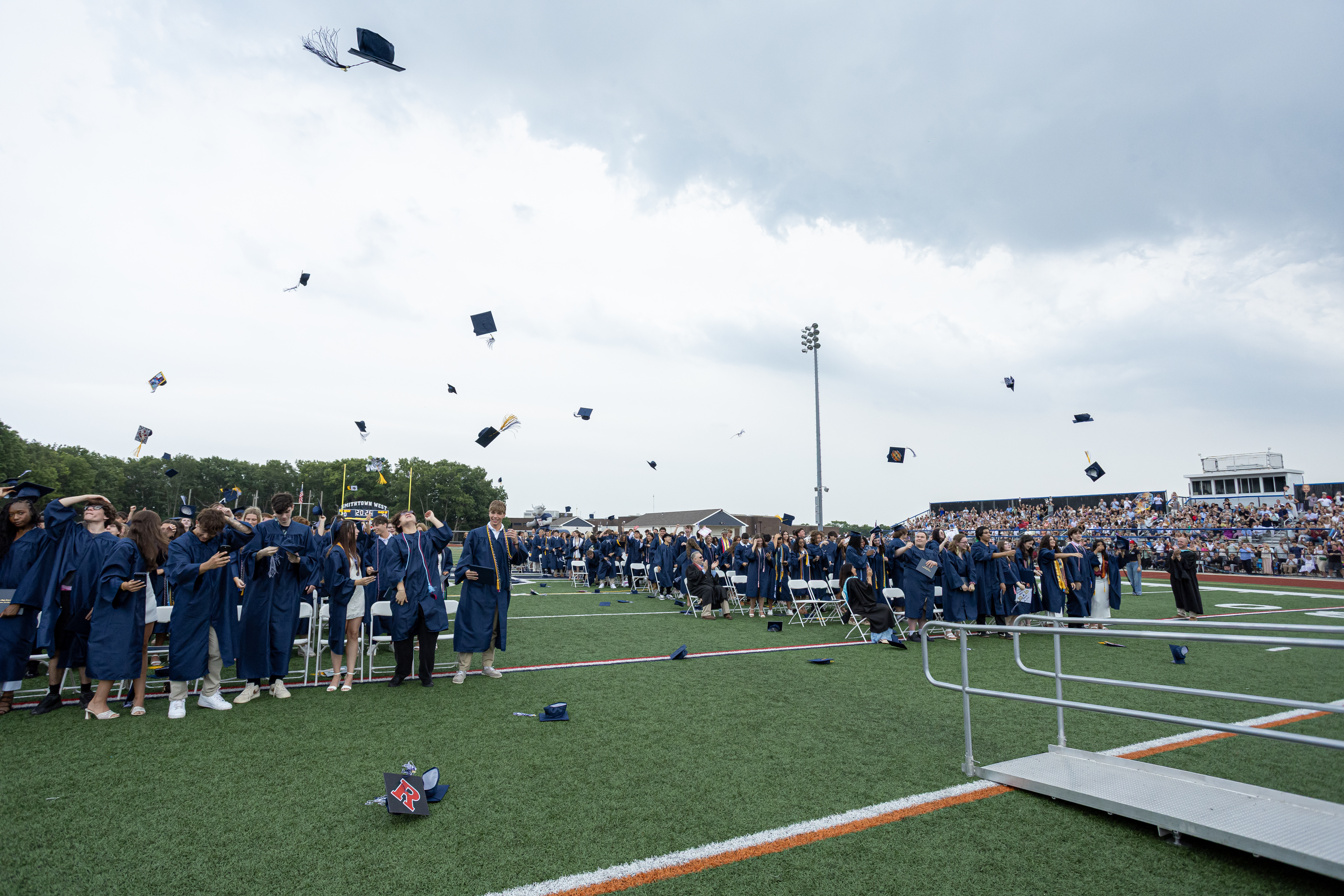 Graduation caps in the air