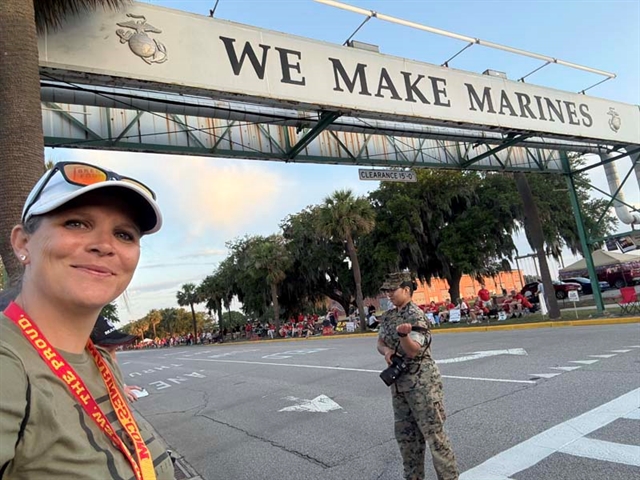Ashley with a Marines sign