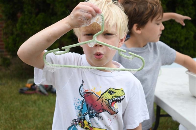 student playing with bubble