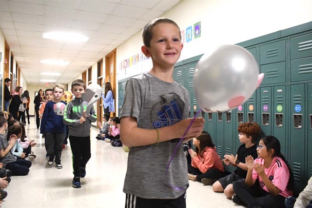 boy holding balloon