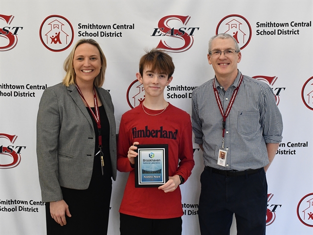 Aidan posing for picture with Stephanie O'Brien and Matt Naeher