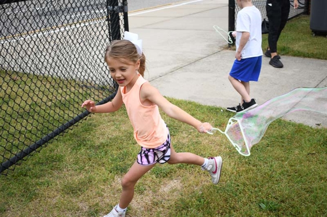 student playing with bubble