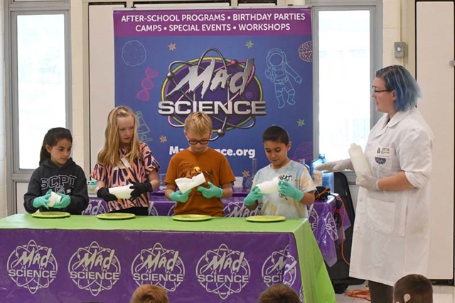 Mad Science instructor with students