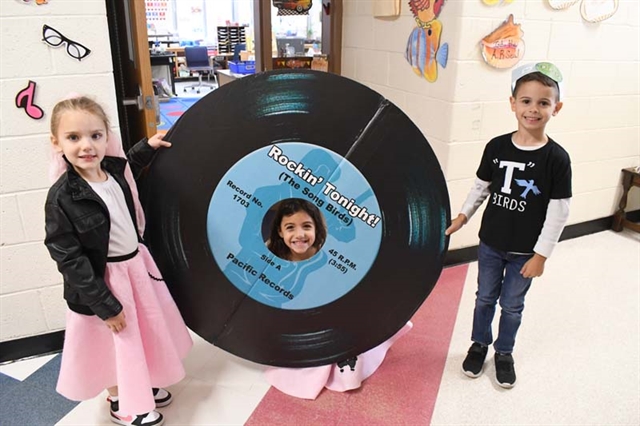 Students dressed up and smiling