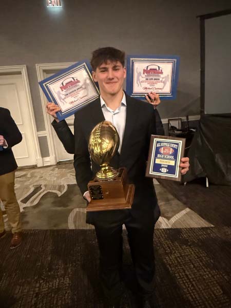Michael holding a trophy