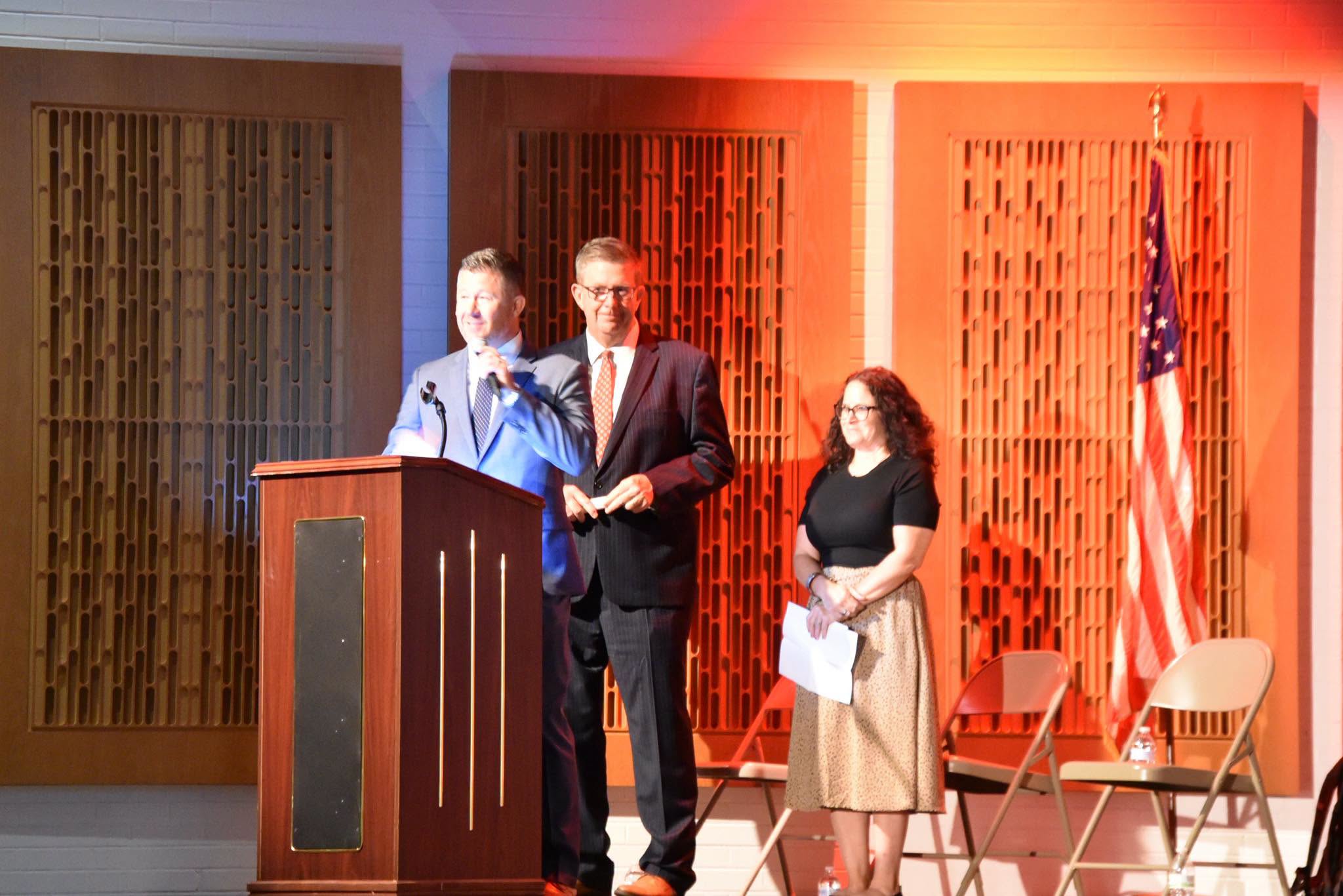 Principal and Superintendent on stage