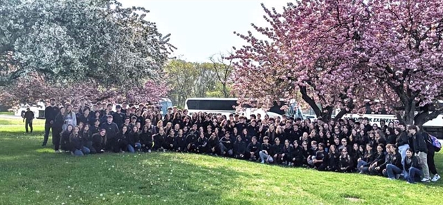 student outside posing for picture