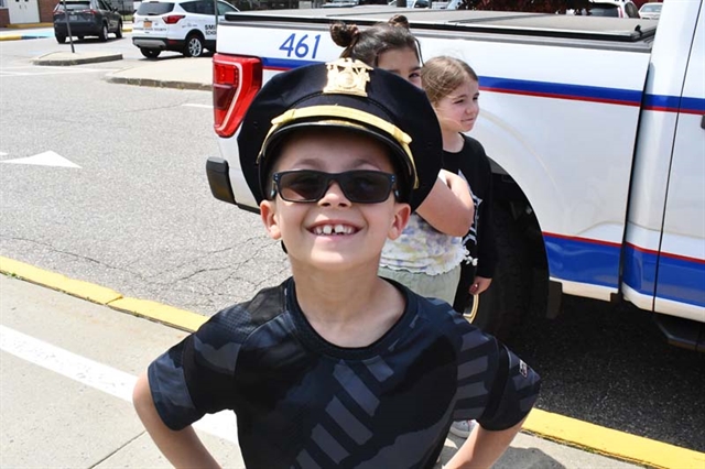 student with police hat