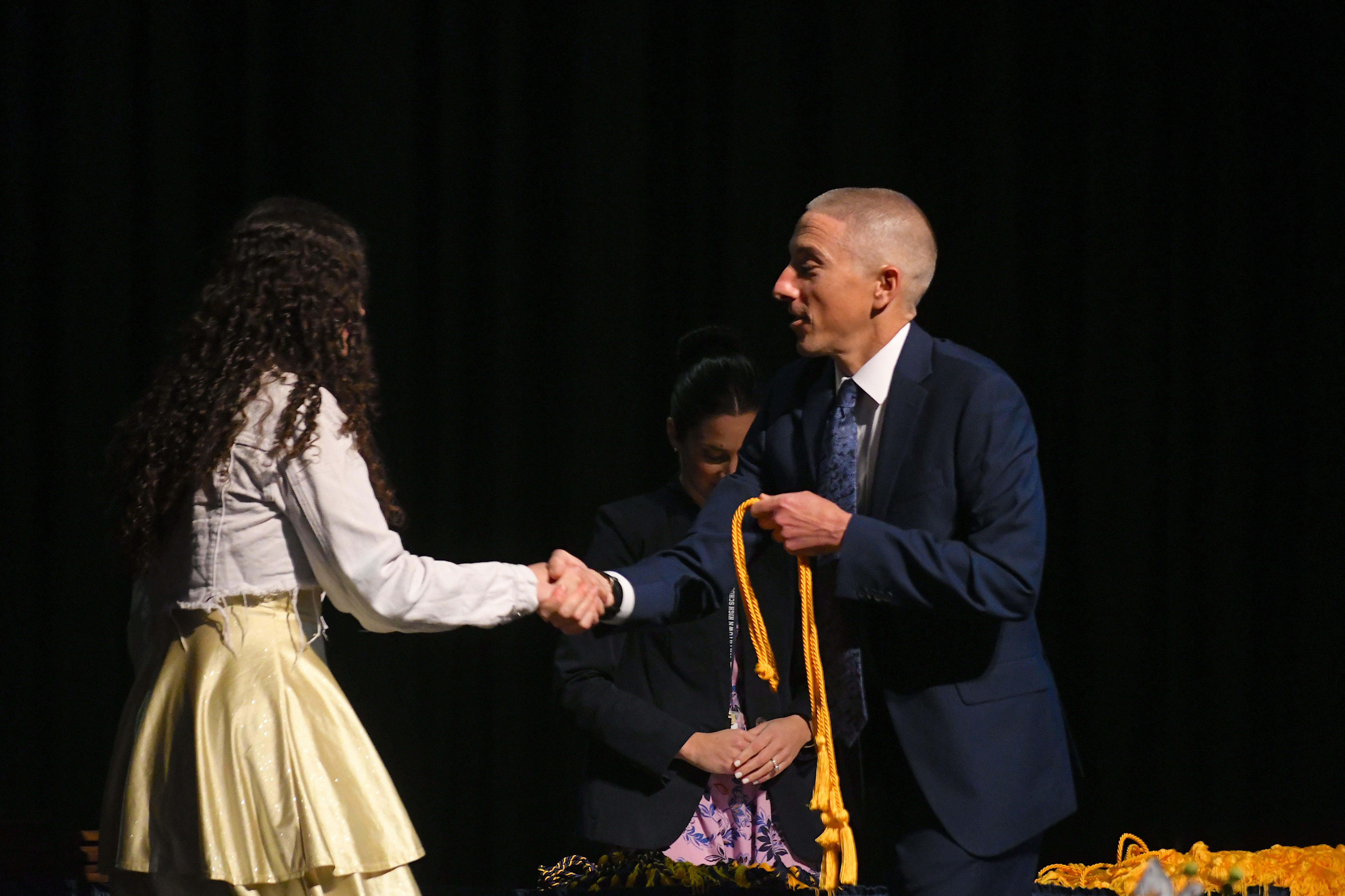 Principal Holl shaking hands