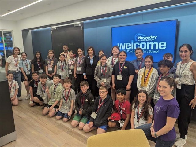 students posing for picture at Newsday