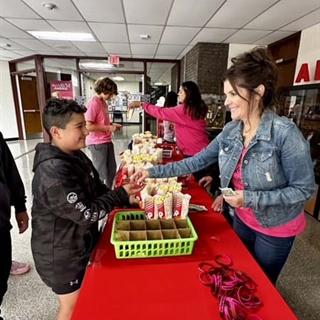 Students getting popcorn
