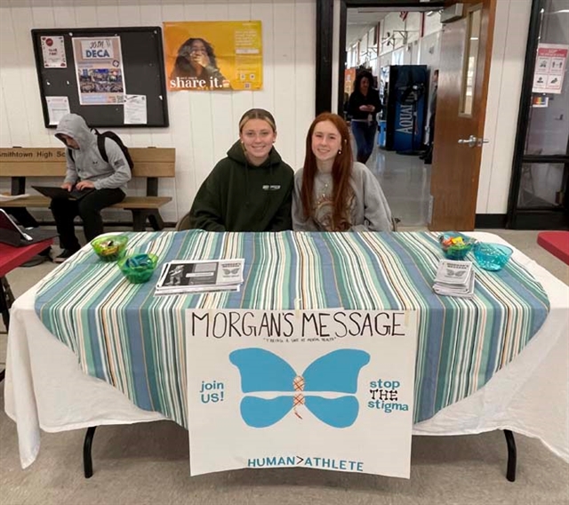 students at club fair posing for picture