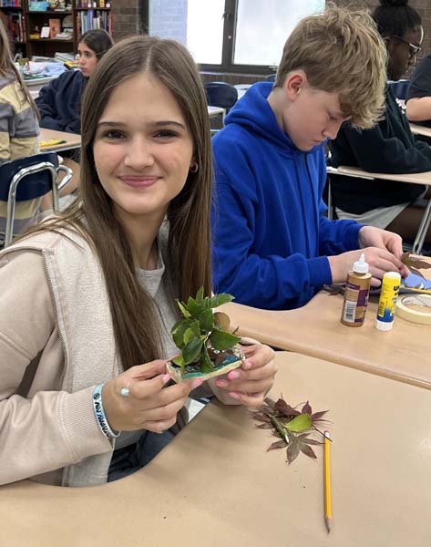 student with plant