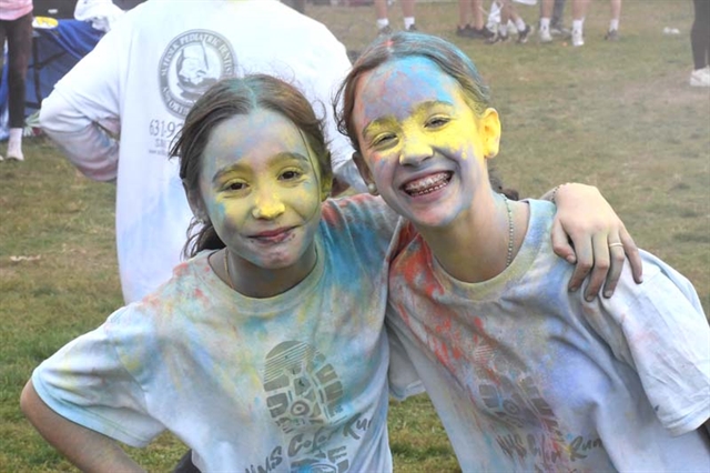 students with color sprayed on faces