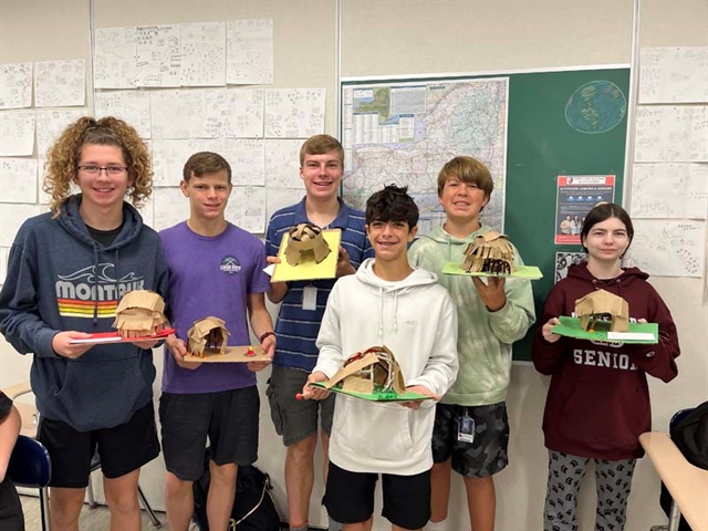 students in classroom smiling