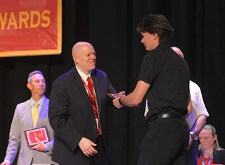 Paul Strader shaking hands