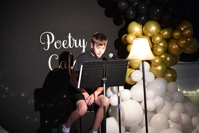 student reading poem