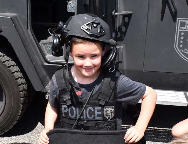 student in police helmet