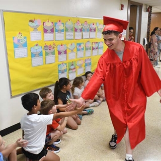 Student giving student high five