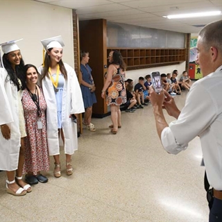 Principal taking picture