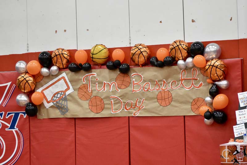 A sign with Tim Bassett's name