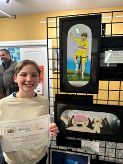 students with artwork behind them