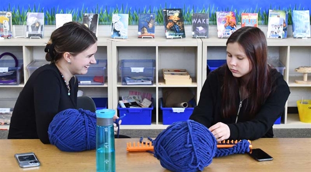 students knitting scarves