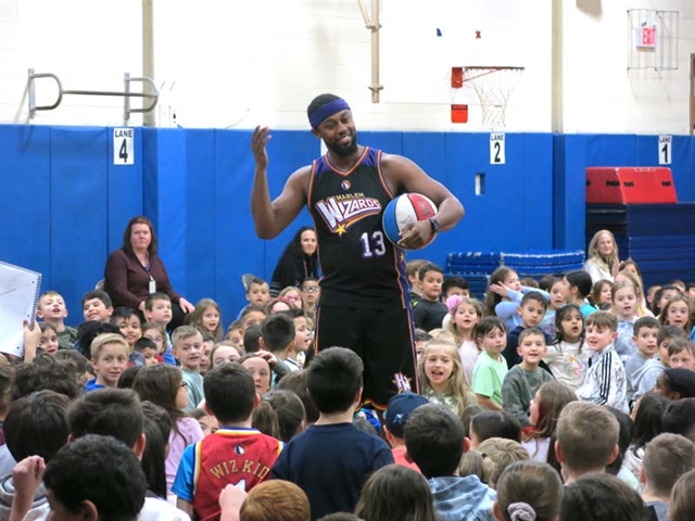 Harlem Wizards with students