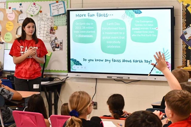 High School East student talking to younger students