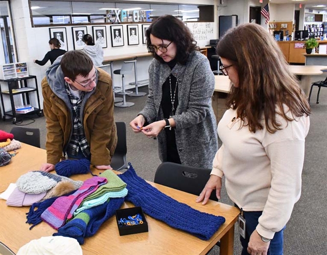 students knitting scarves