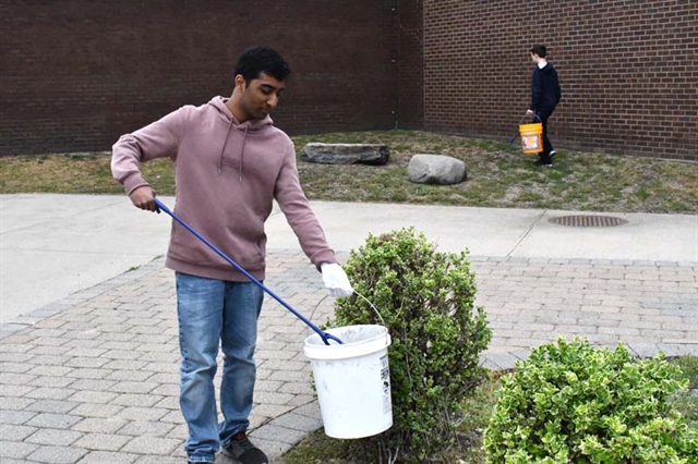 student cleaning up