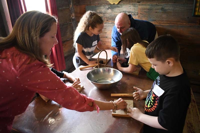 students working on leather stamps