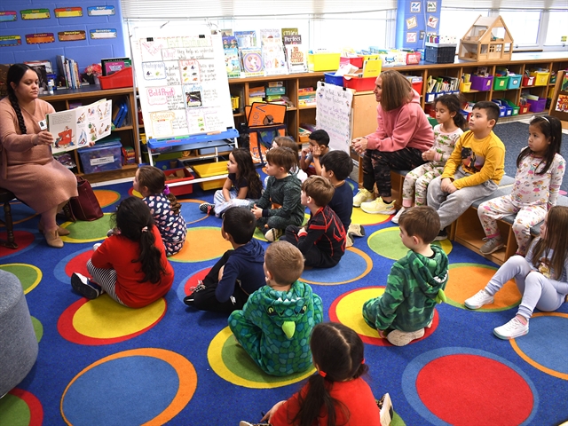 Smithtown librarian reading to students