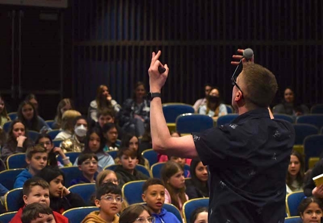 John Schu speaking to students