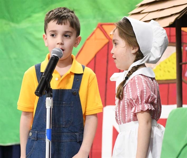 students on stage performing