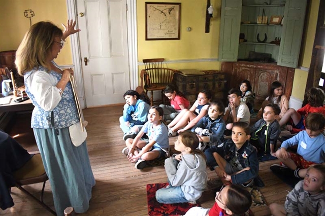 historian teaching children
