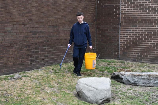 student cleaning up