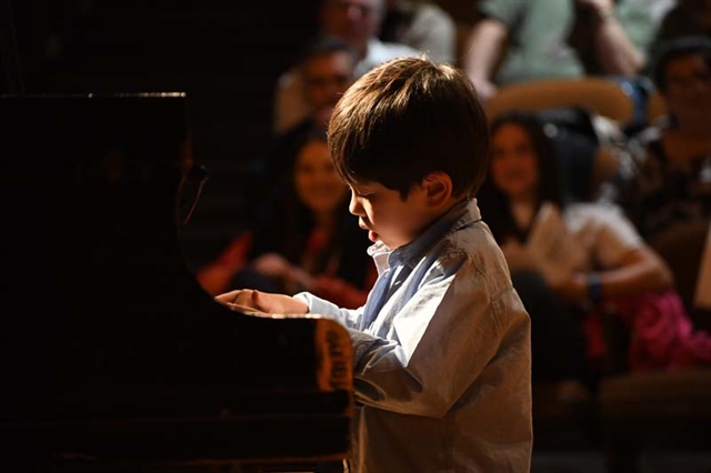 boy playing piano