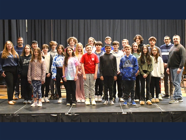 students and teachers smiling