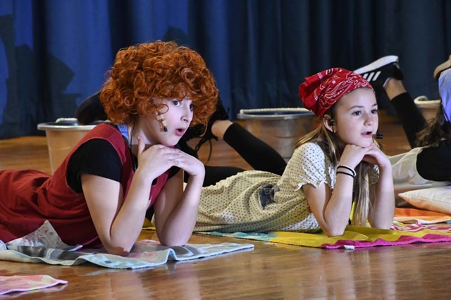 students on stage performing