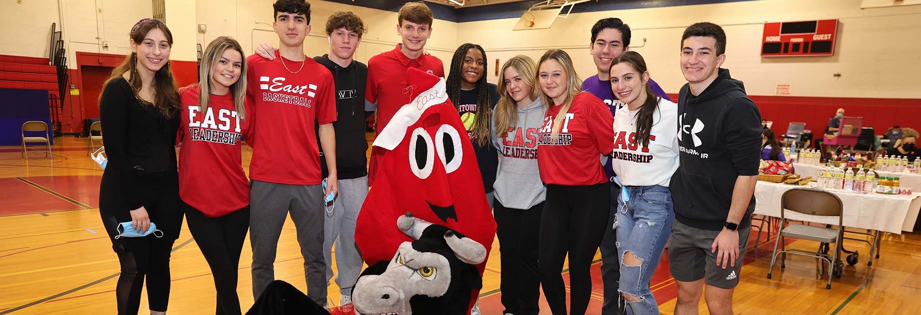 Students gather with East Mascot